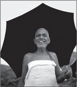 Bhagavan with umbrella, smiling Bhagavan with umbrella, smiling