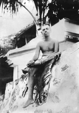 Sitting on tiger-skin on the Skandasramam wall