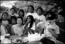 Children eating snacks prepared by Hyuna Lee
